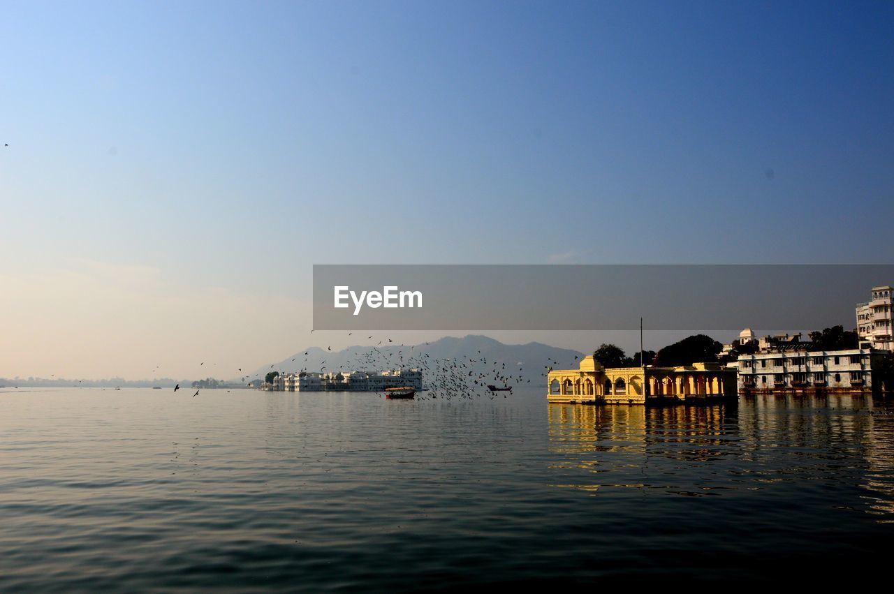 Scenic view of lake against clear sky