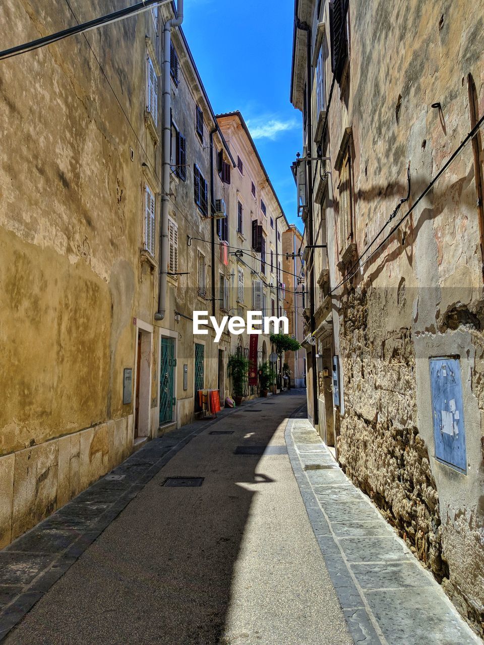 Narrow alley along buildings