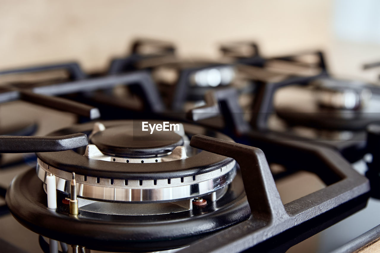 Gas stove with hob in kitchen, close up