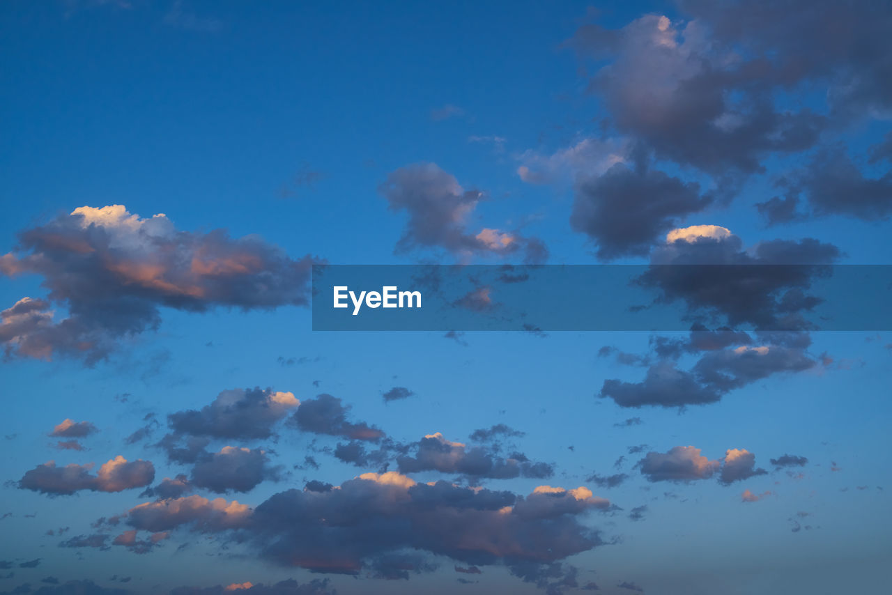 LOW ANGLE VIEW OF CLOUDS IN BLUE SKY