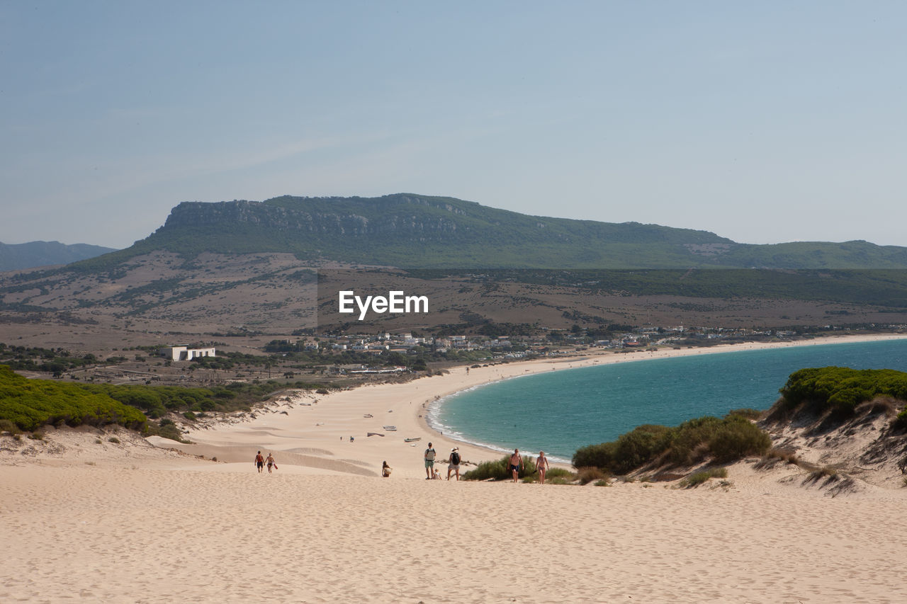 Scenic view of beach against clear sky