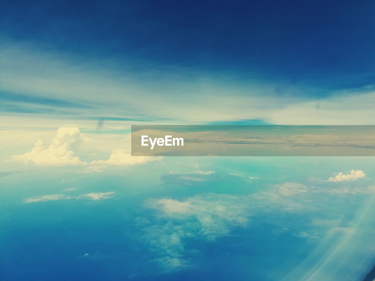 AERIAL VIEW OF CLOUDS OVER BLUE SKY