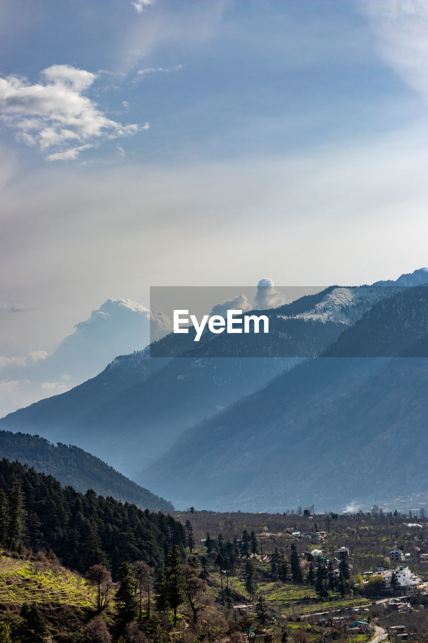 Scenic view of snowcapped mountains against sky