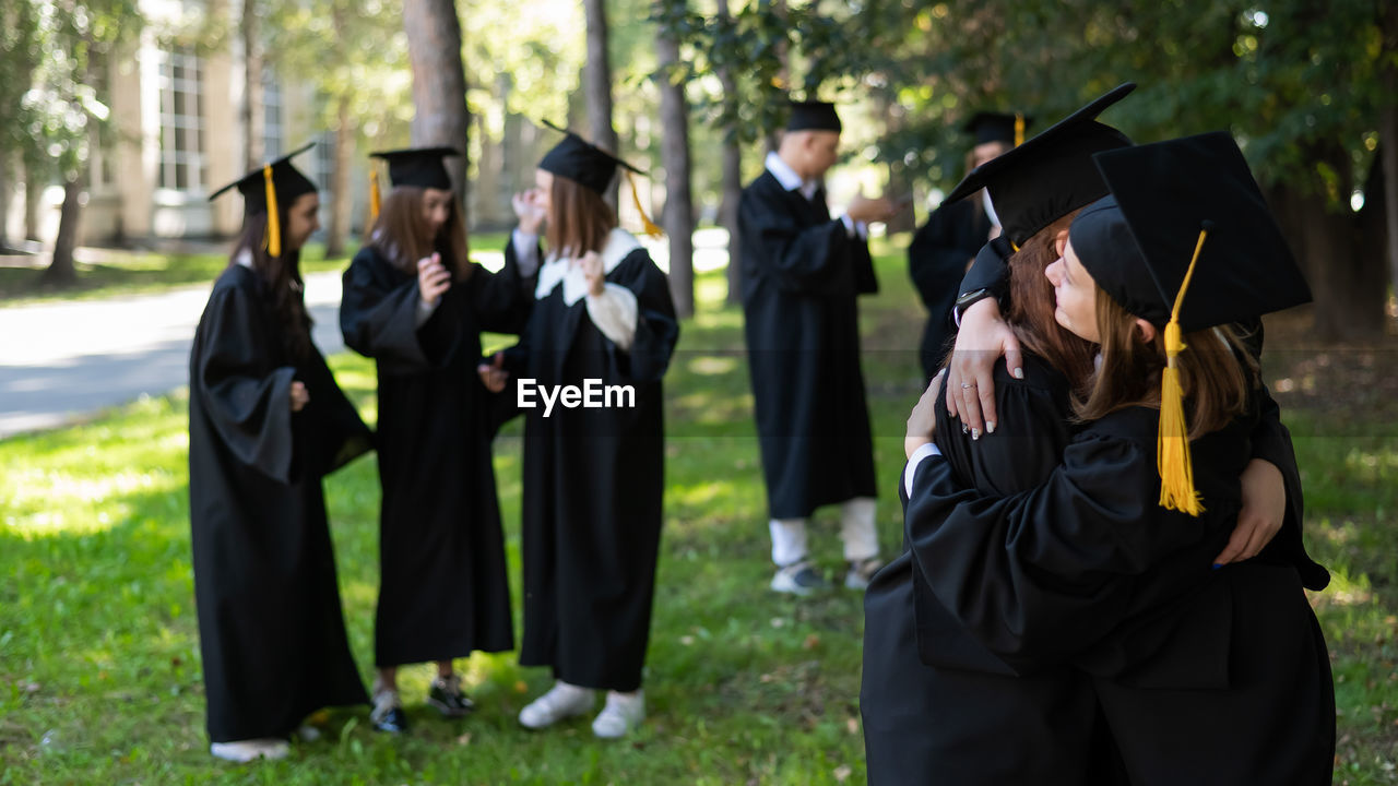 rear view of students wearing graduation