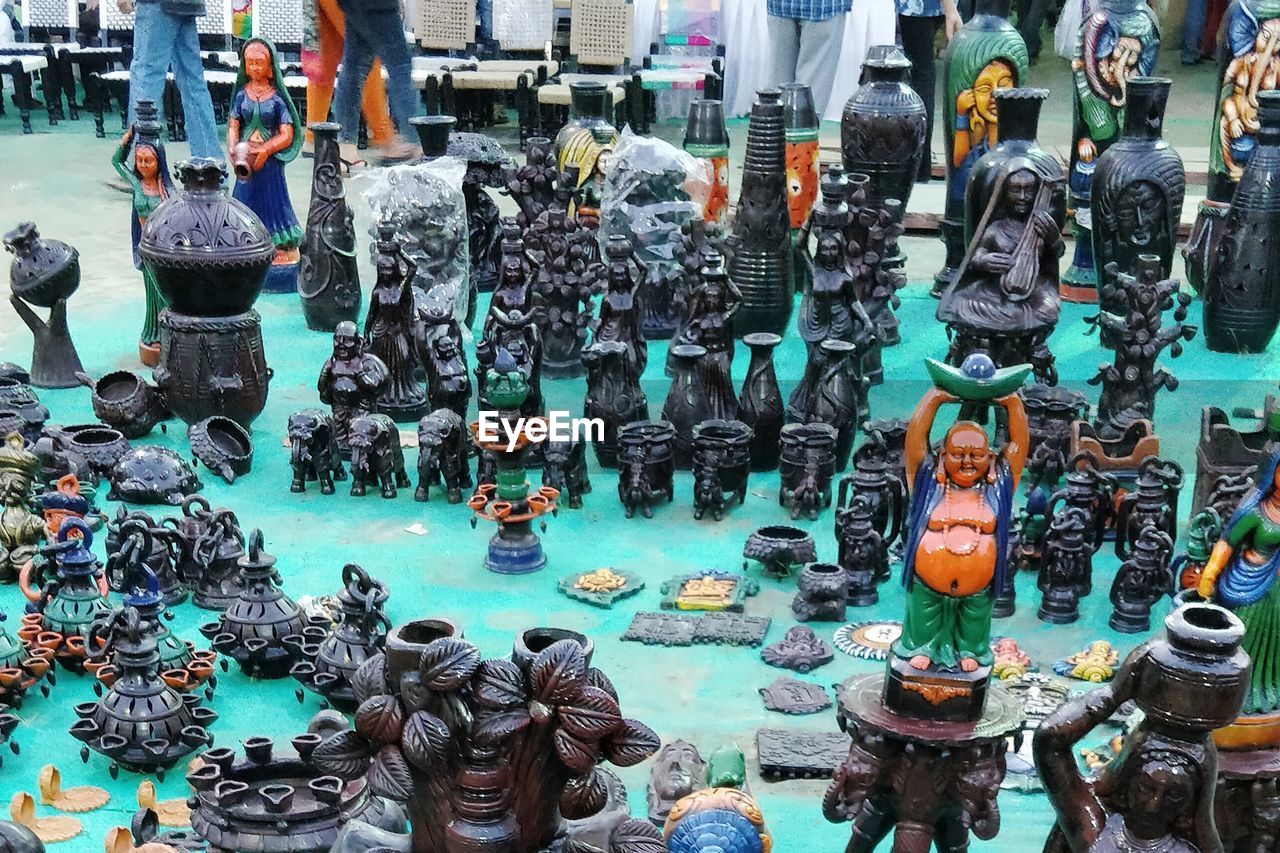 HIGH ANGLE VIEW OF STATUES AT MARKET