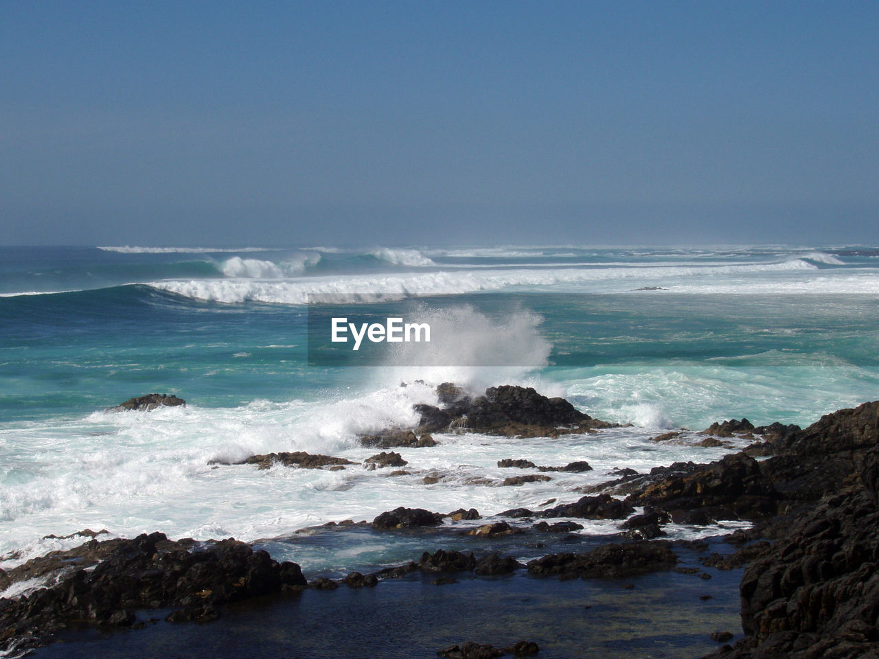 Ocean waves for surfing in the sea at the coastal line