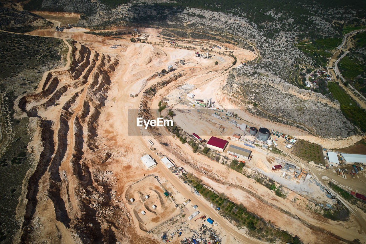 Structures of plant producing sand, crushed stone, cement and batching concrete aerial view. 