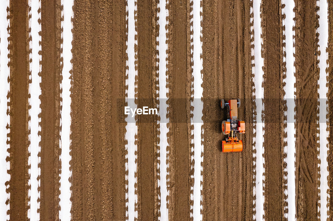 Aerial view of cultivated agricultural field in spring