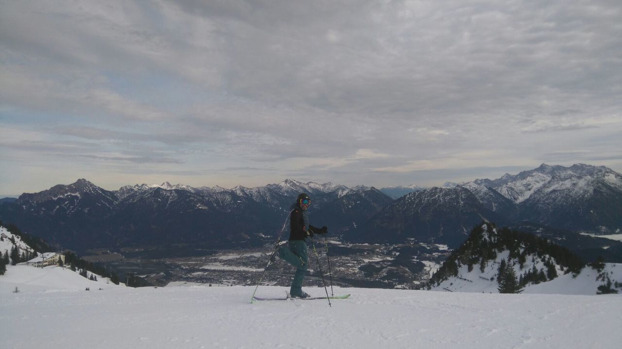 TOURISTS ON SNOW COVERED MOUNTAIN