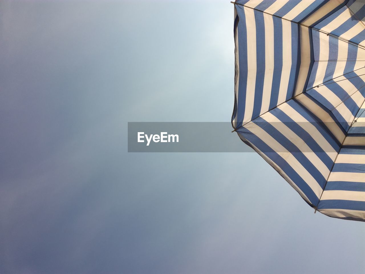 Low angle view of beach umbrella against sky