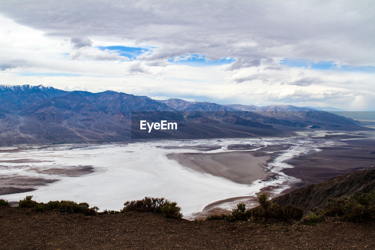 Scenic view of landscape and mountains against sky