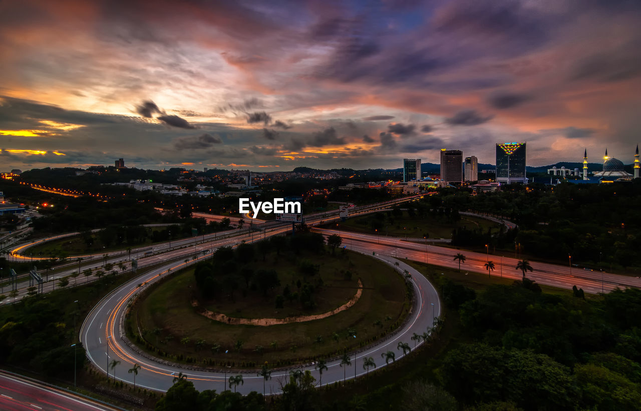 High angle view of city against cloudy sky