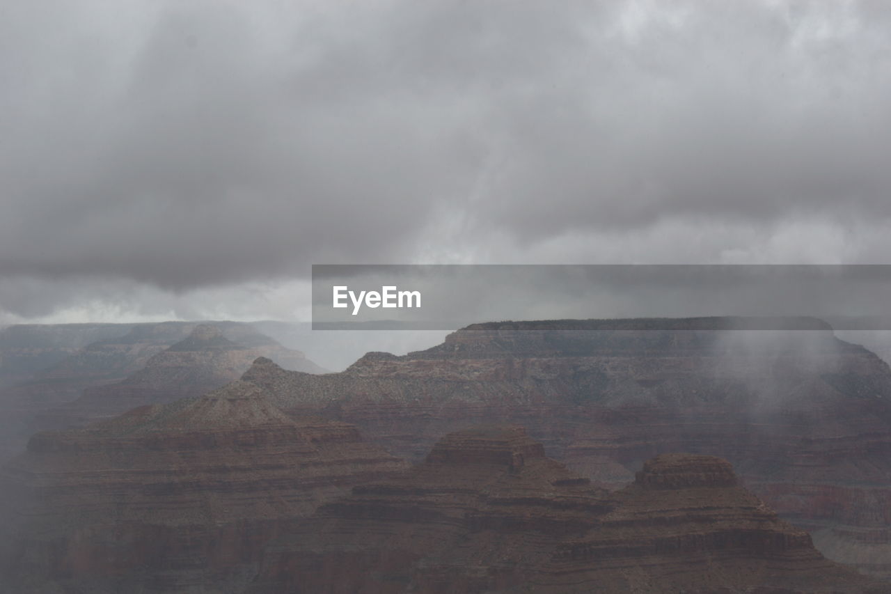 VIEW OF CLOUDS OVER LANDSCAPE