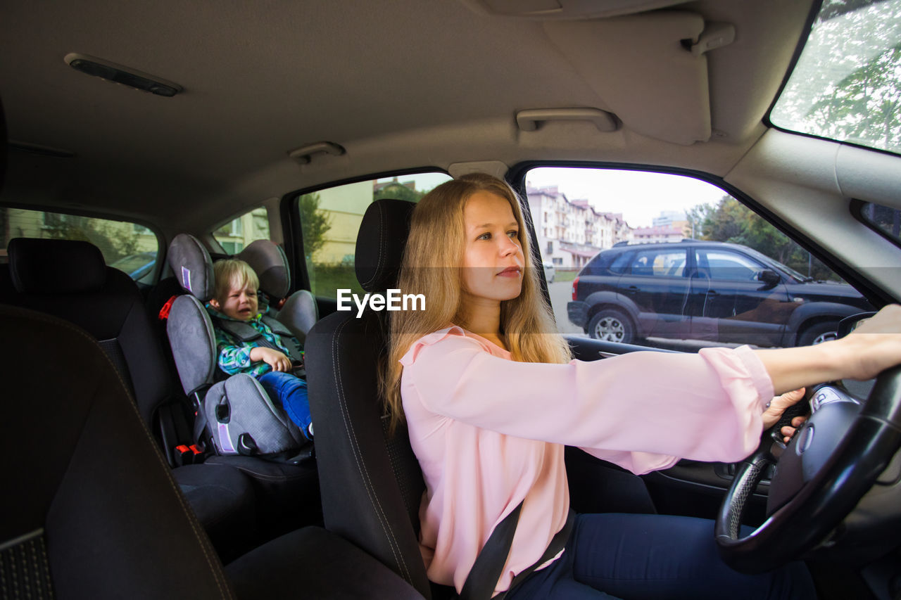 Mother and son in car