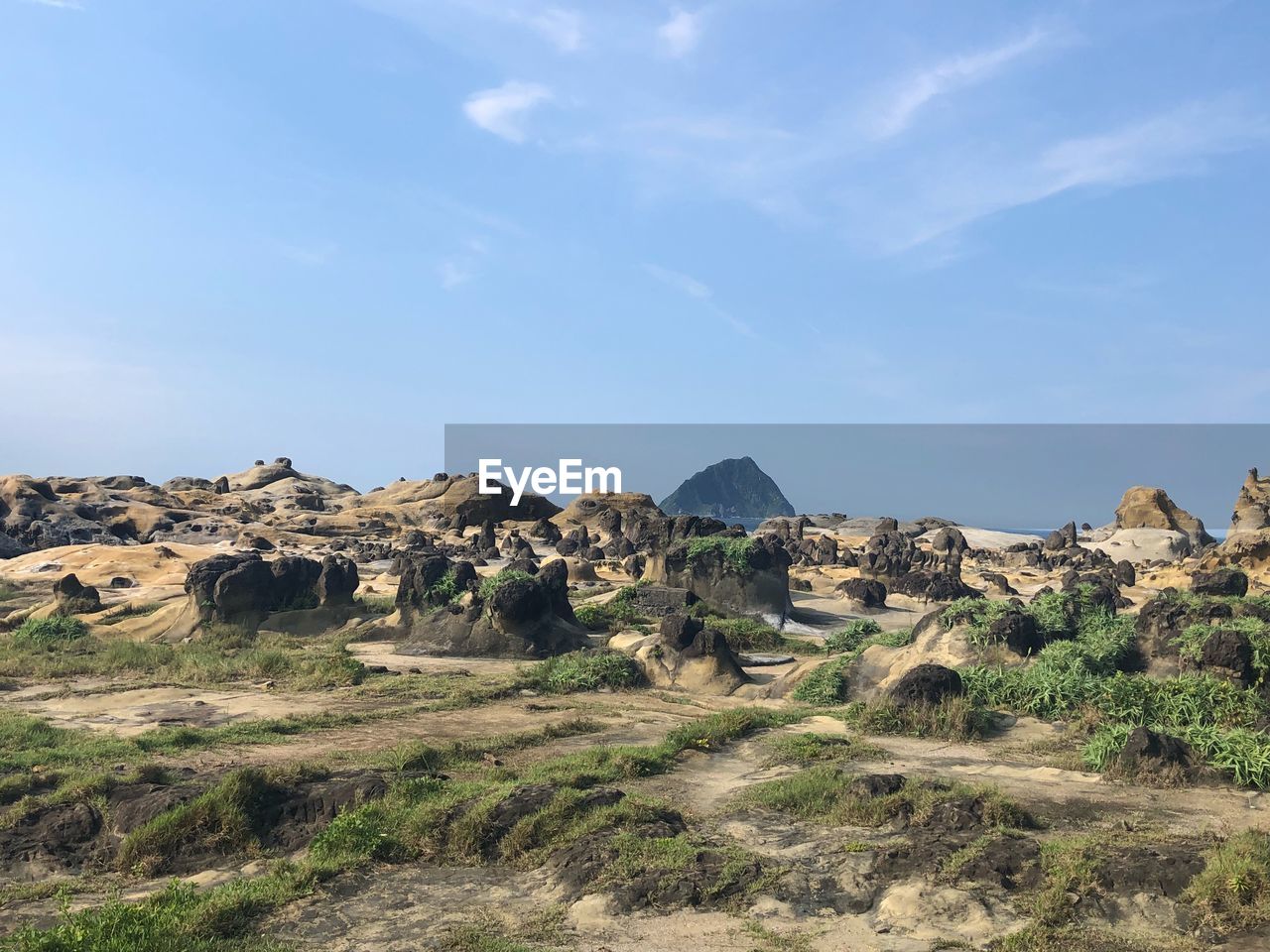 Rock formations on landscape against sky