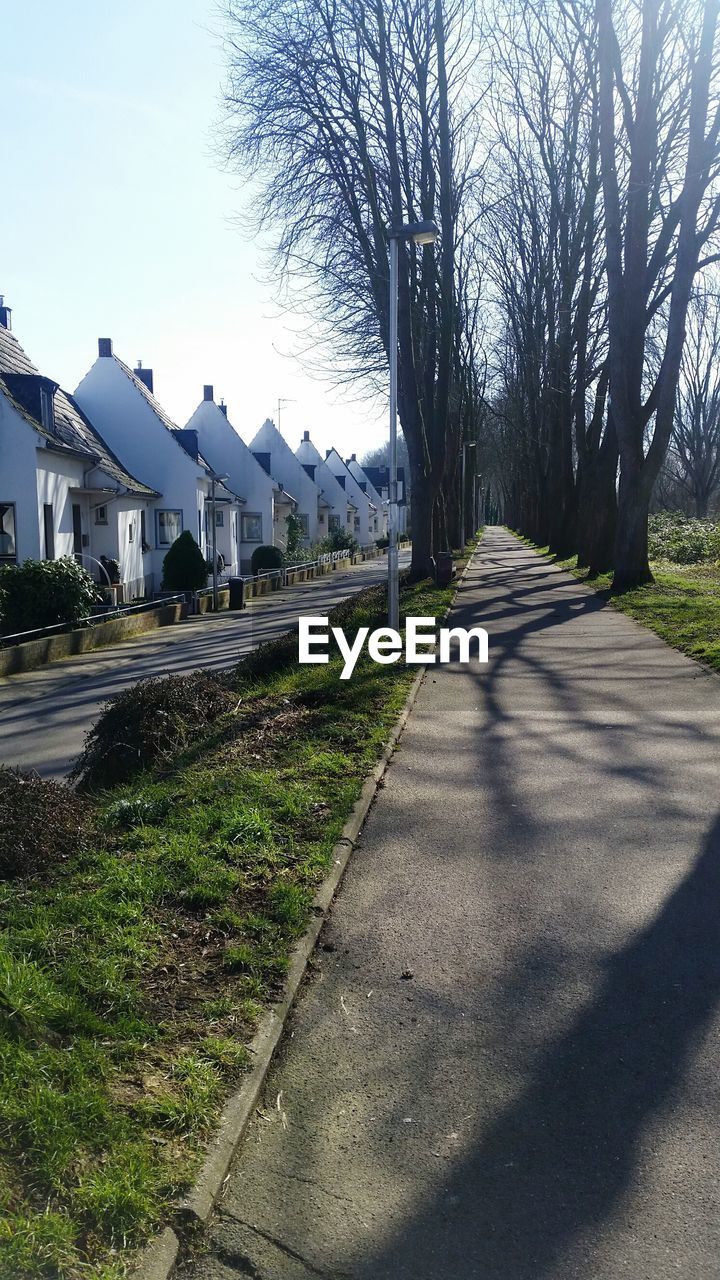 Narrow road along built structures