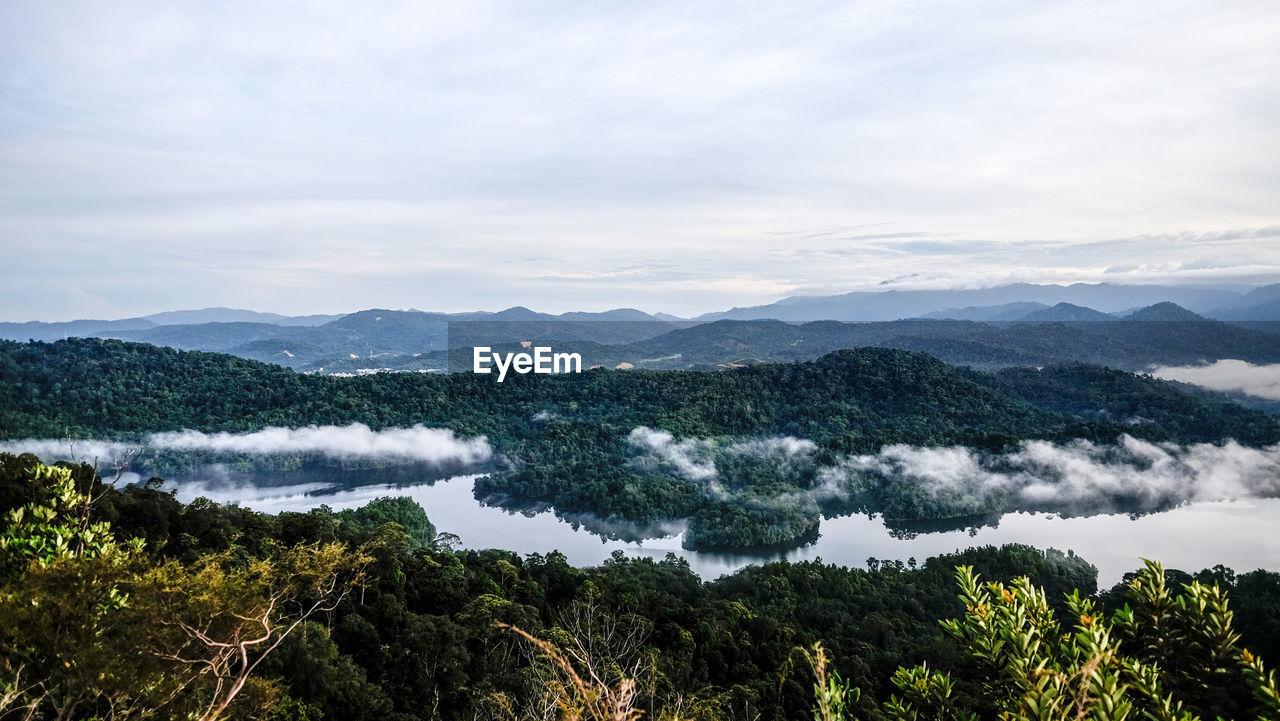 SCENIC VIEW OF MOUNTAINS AND SEA AGAINST SKY