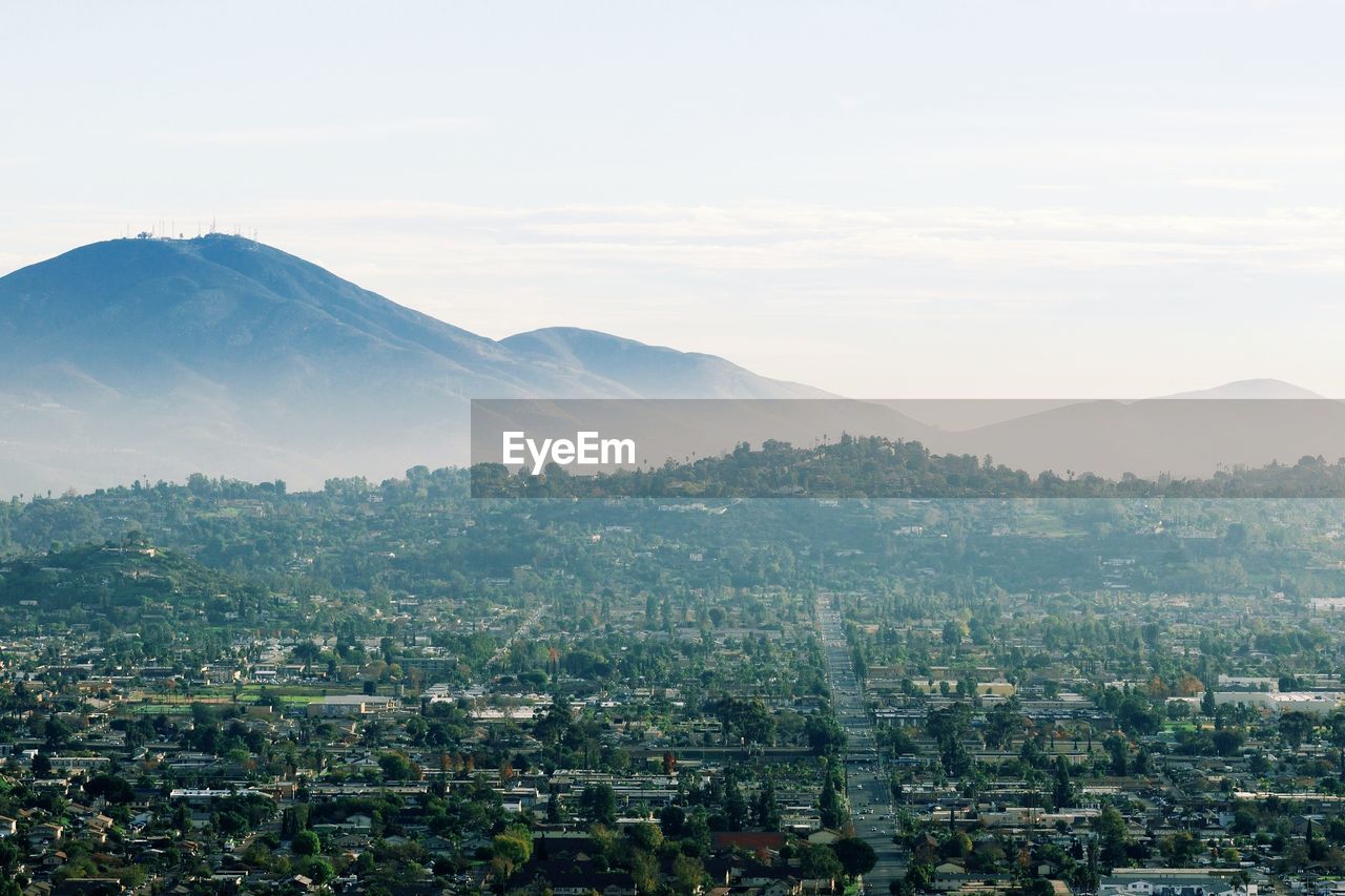 Aerial view of cityscape against sky