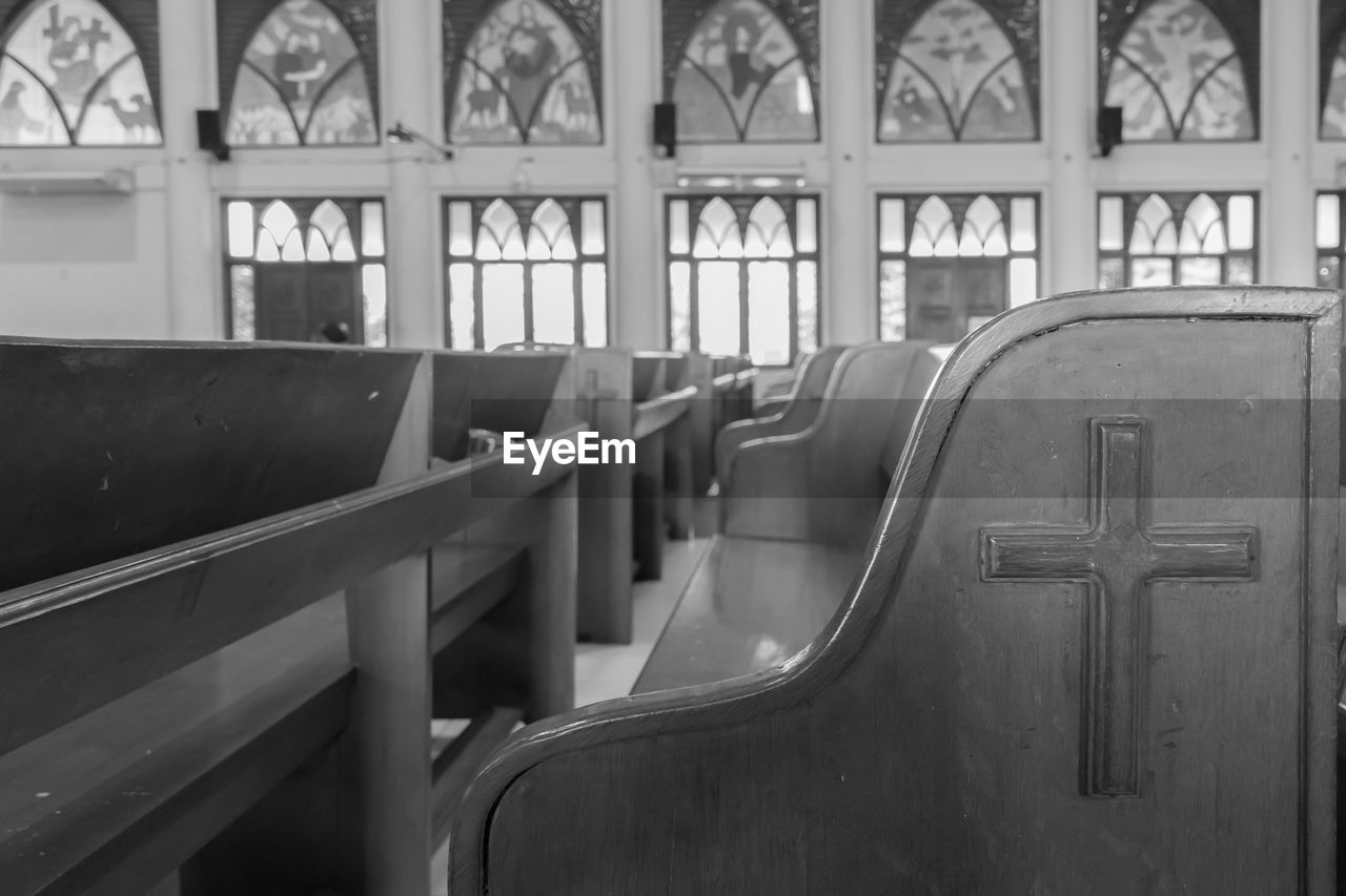 Close-up of pews in church