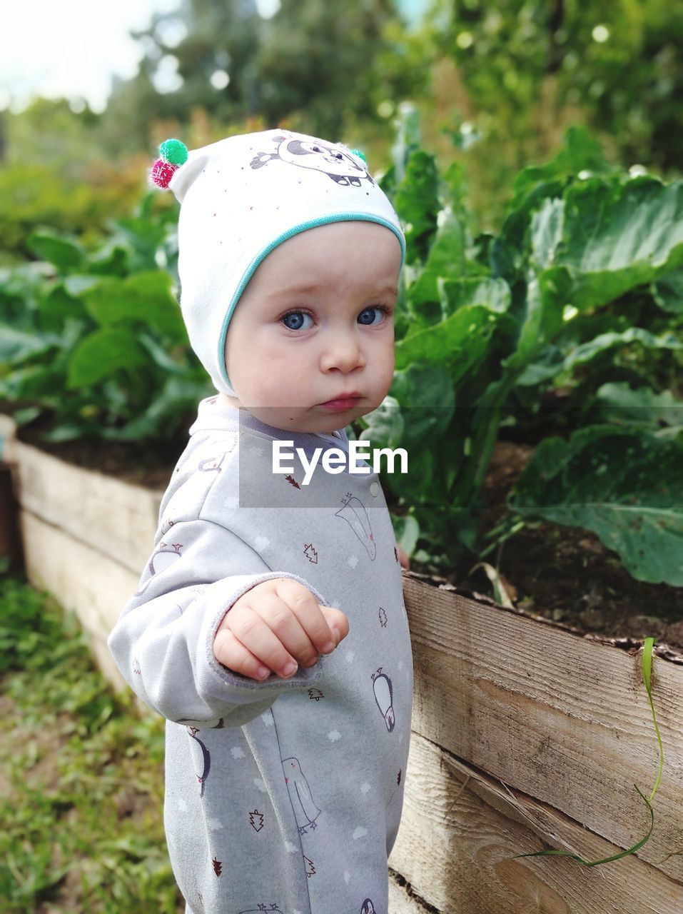 Portrait of cute girl standing outdoors