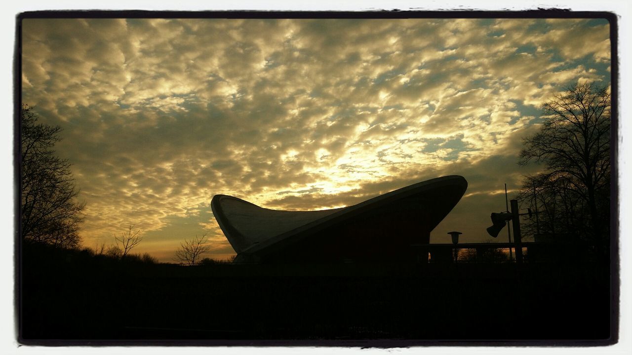 SILHOUETTE OF BUILT STRUCTURE AT DUSK