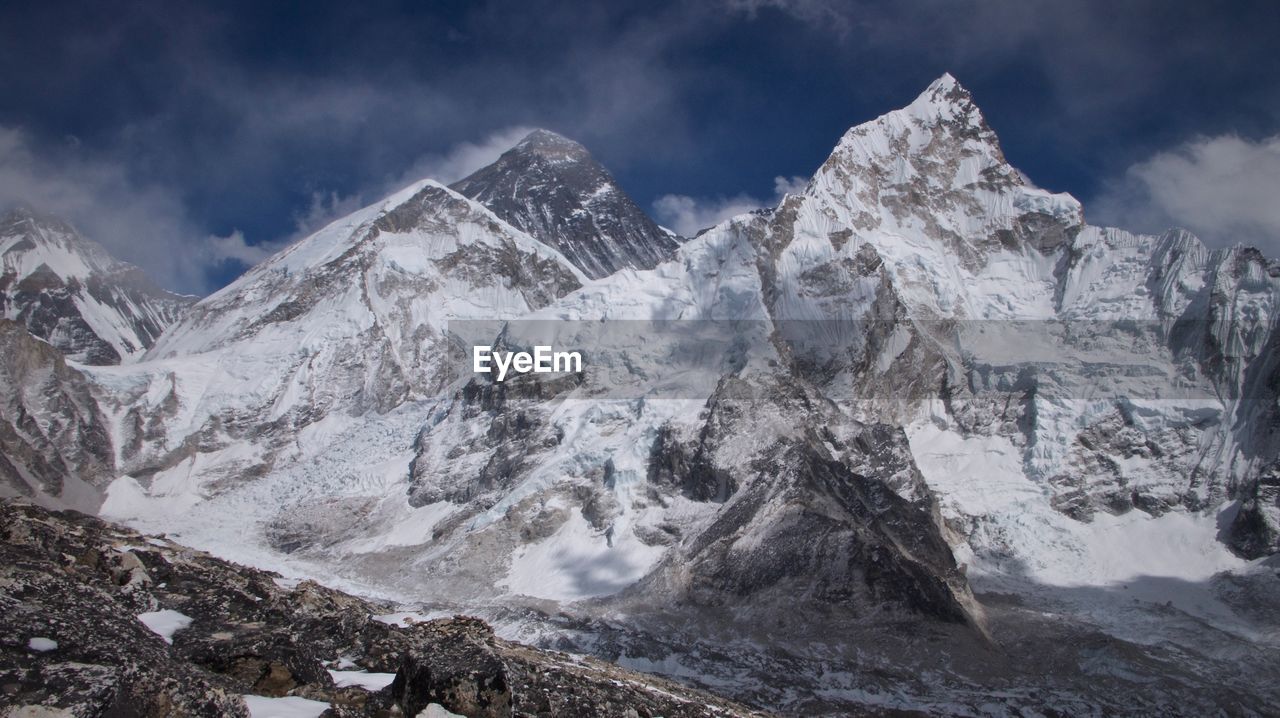 Scenic view of snow covered mountains against sky