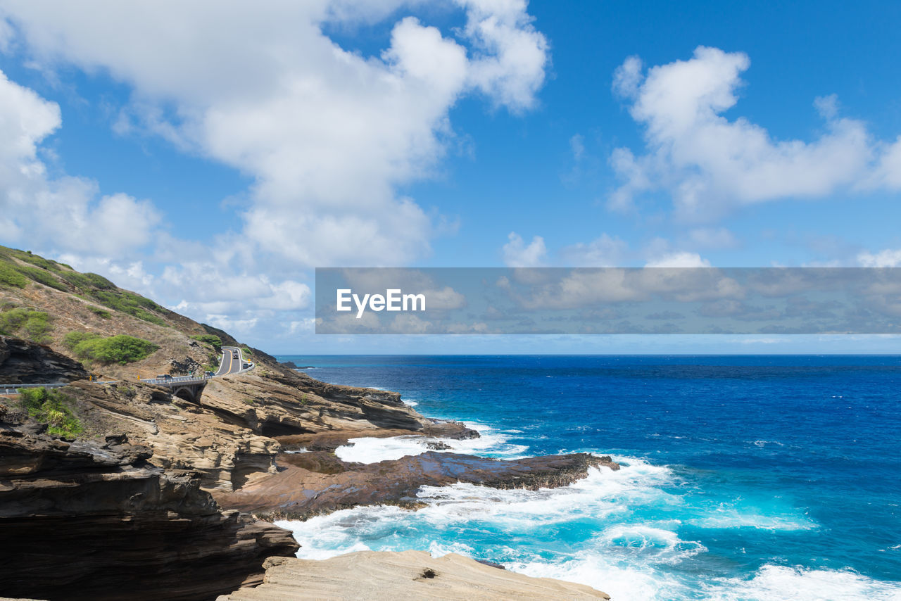 Scenic view of sea against blue sky