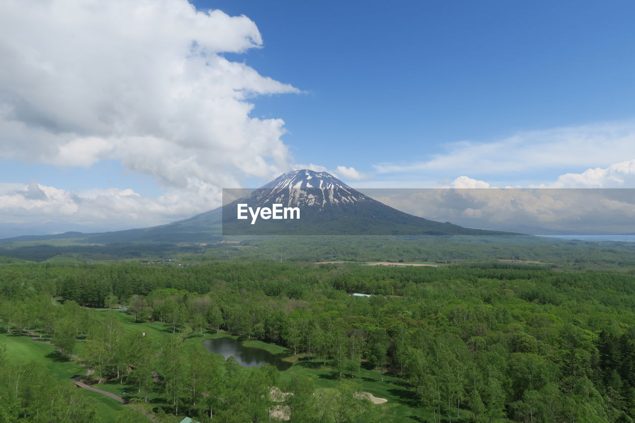 Scenic view of mountain against cloudy sky