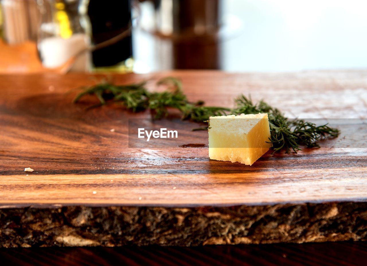 Close-up of cheese on cutting board