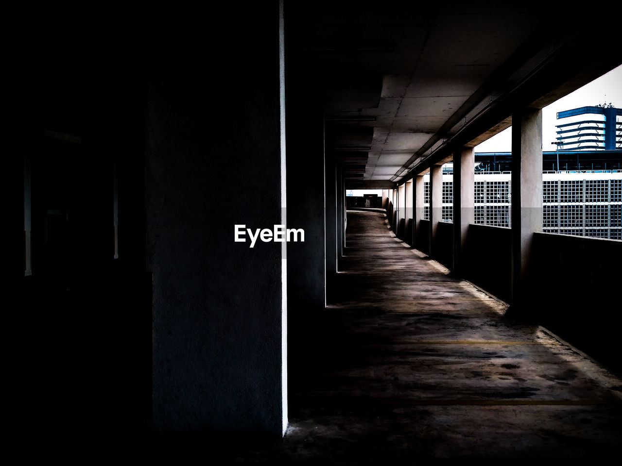 EMPTY CORRIDOR WITH BUILDING