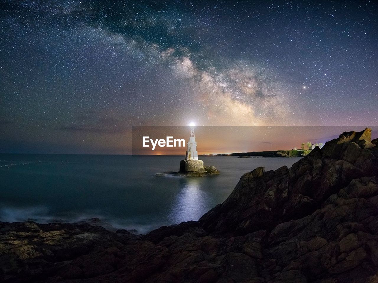 Scenic view of sea against sky at night