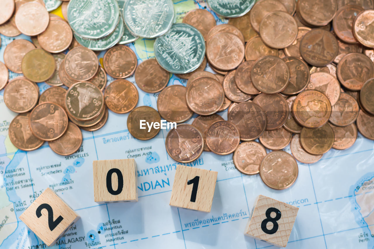 CLOSE-UP HIGH ANGLE VIEW OF COINS