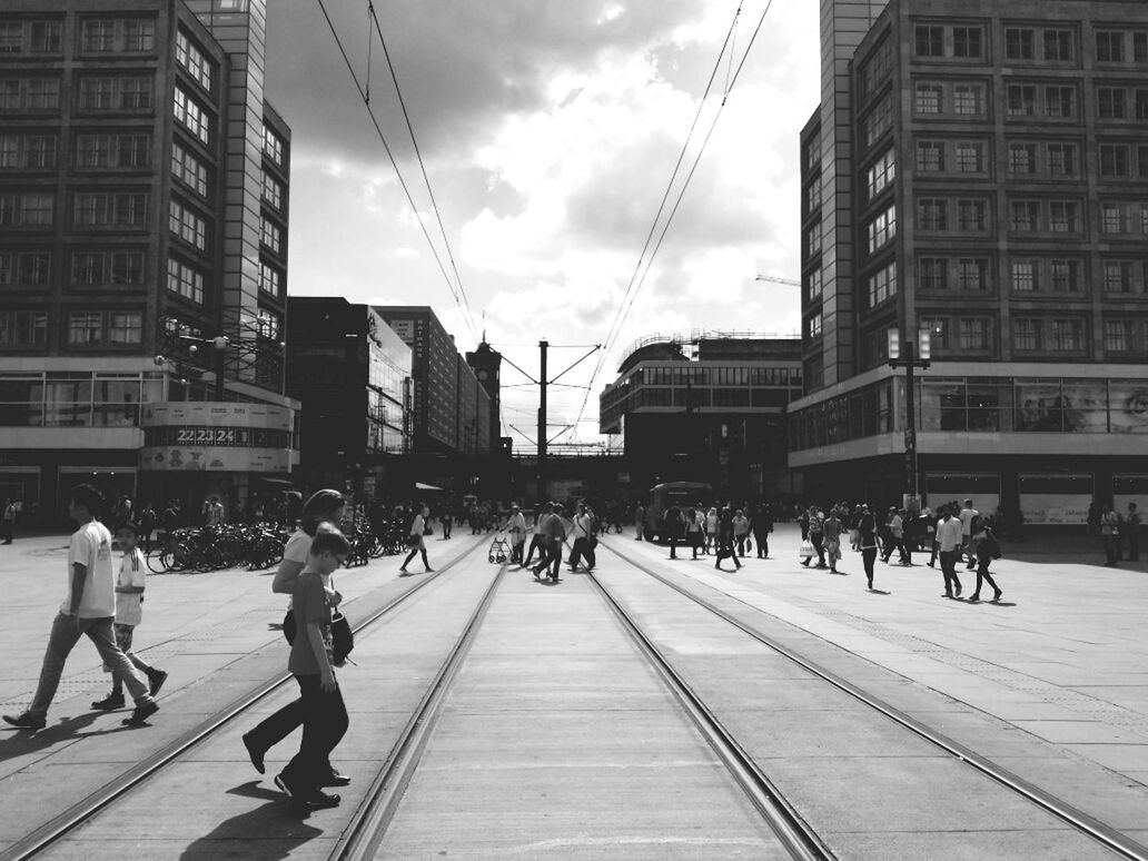 PEOPLE WALKING ON CITY STREET IN CITY