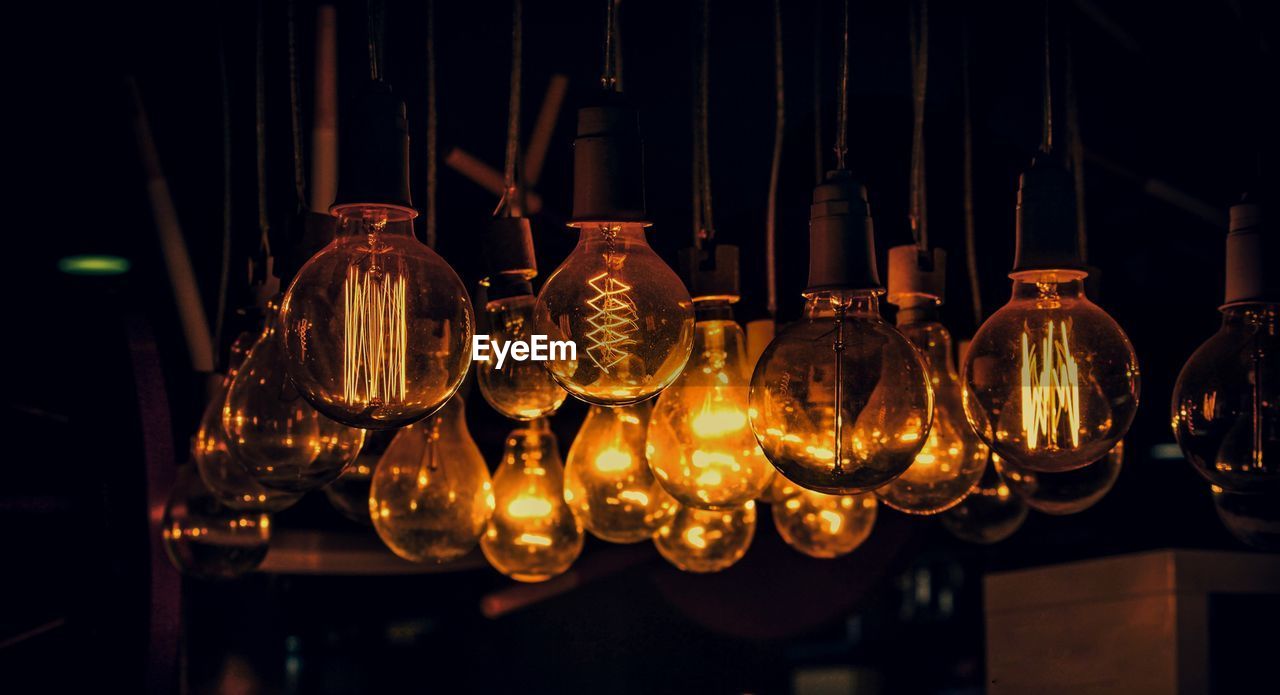 Beautiful glowing golden yellow filament bulbs at night in the interior