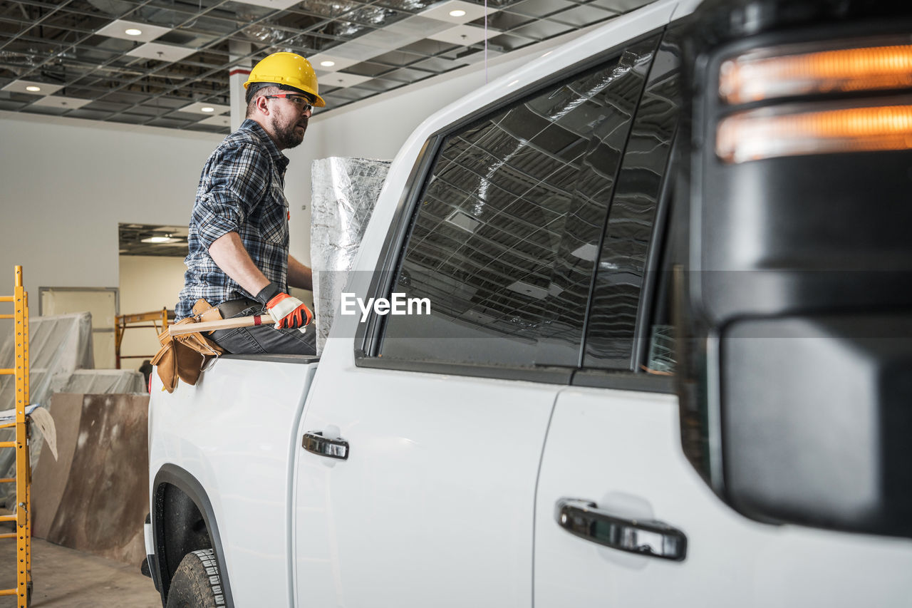 side view of man working on road