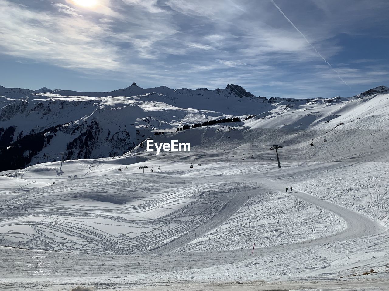 Scenic view of snow covered mountains against sky