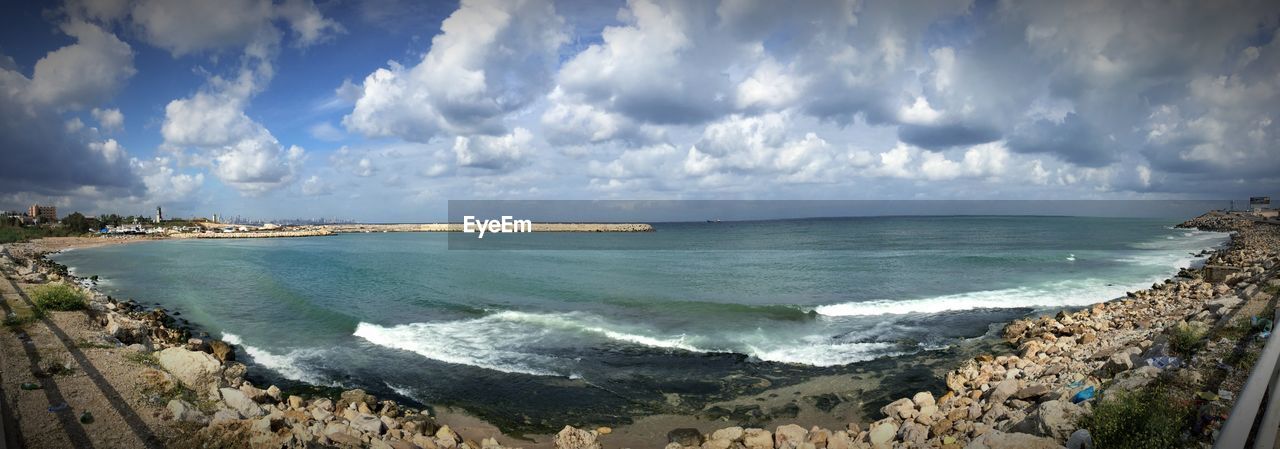 VIEW OF SEA AGAINST CLOUDY SKY