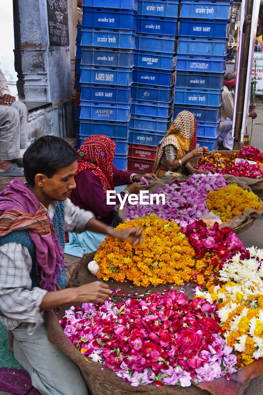 PEOPLE IN MARKET FOR SALE AT STREET