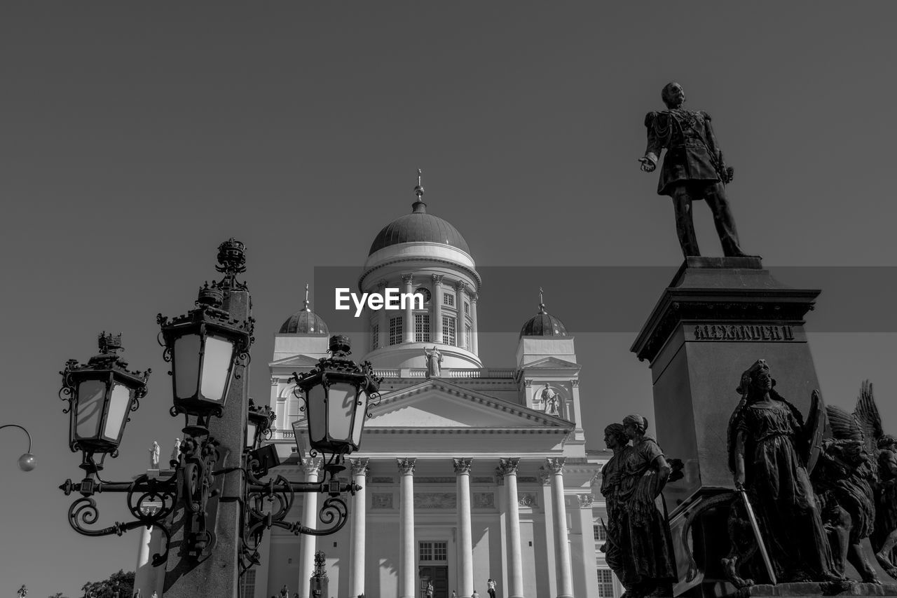 architecture, built structure, building exterior, black and white, sky, travel destinations, dome, statue, landmark, sculpture, monochrome, the past, history, monochrome photography, representation, nature, human representation, low angle view, travel, religion, building, clear sky, city, place of worship, tourism, government, no people, belief, architectural column, spirituality, outdoors, male likeness, craft