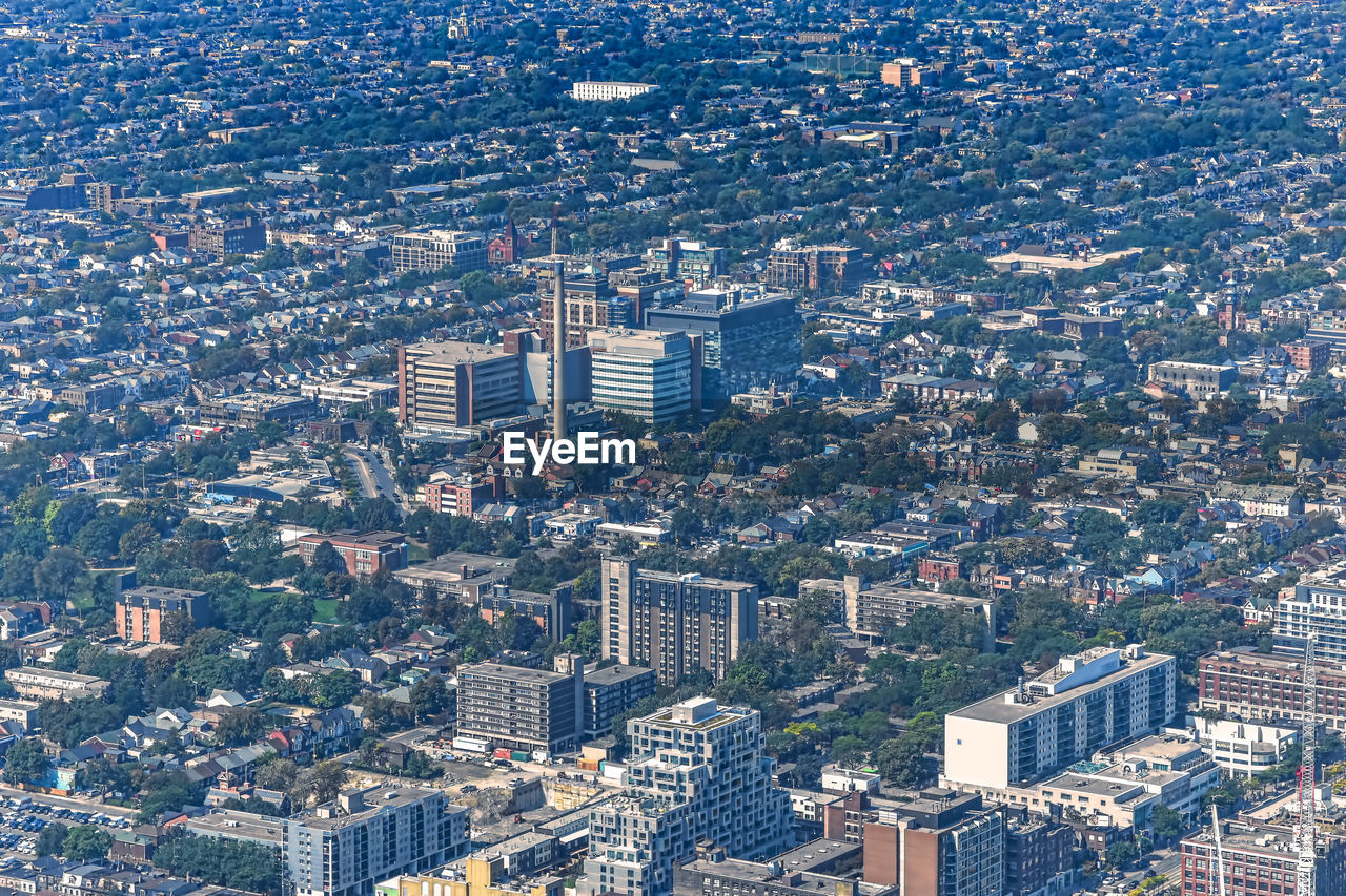 Panoramic view of the city of toronto, with residential areas and a factory downtown. toronto