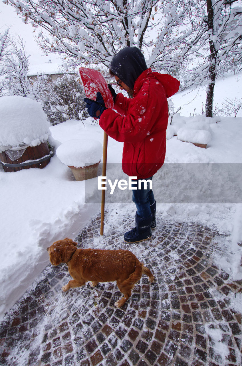 FULL LENGTH OF GIRL STANDING IN SNOW