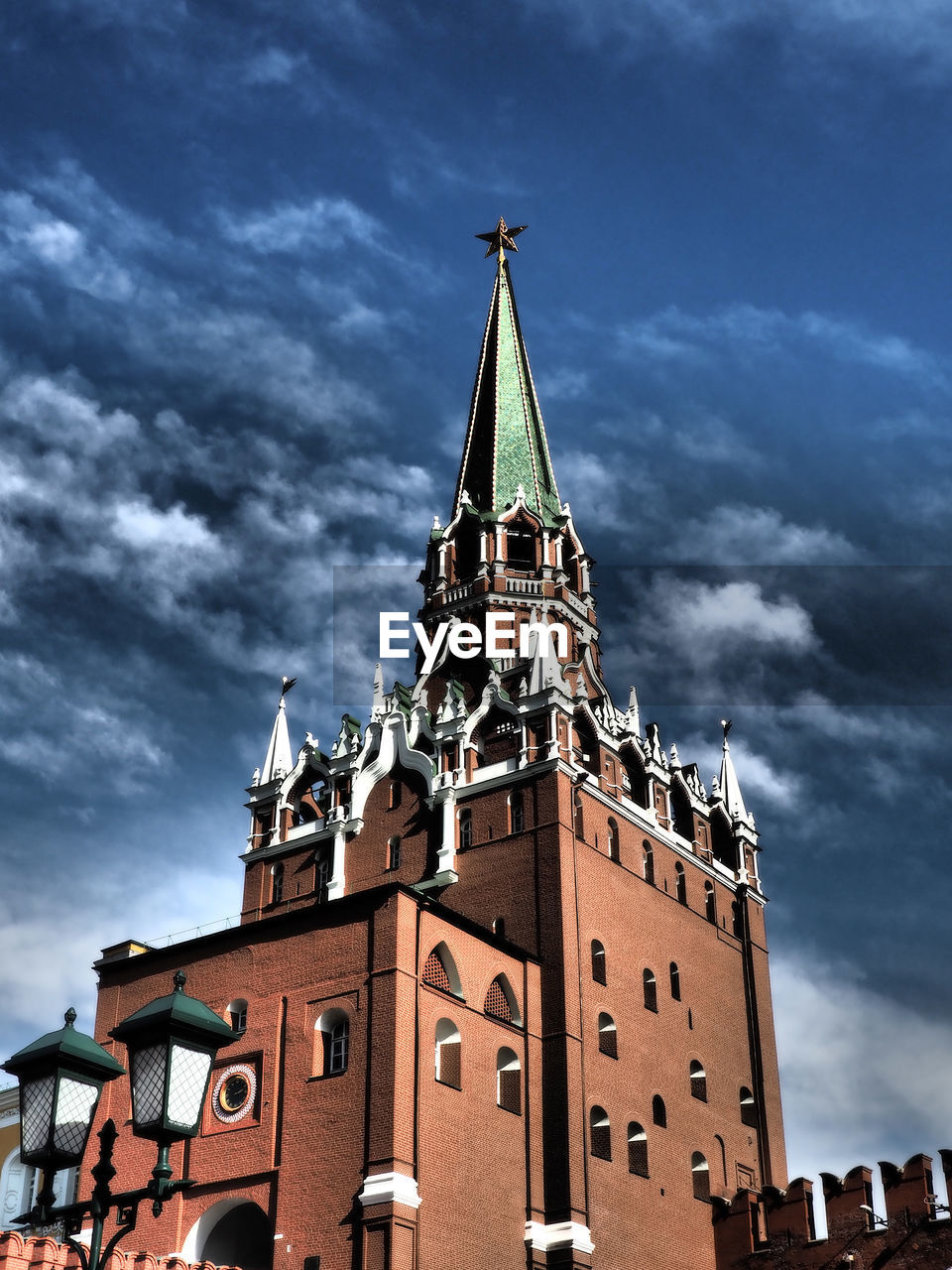 Low angle view of building against cloudy sky