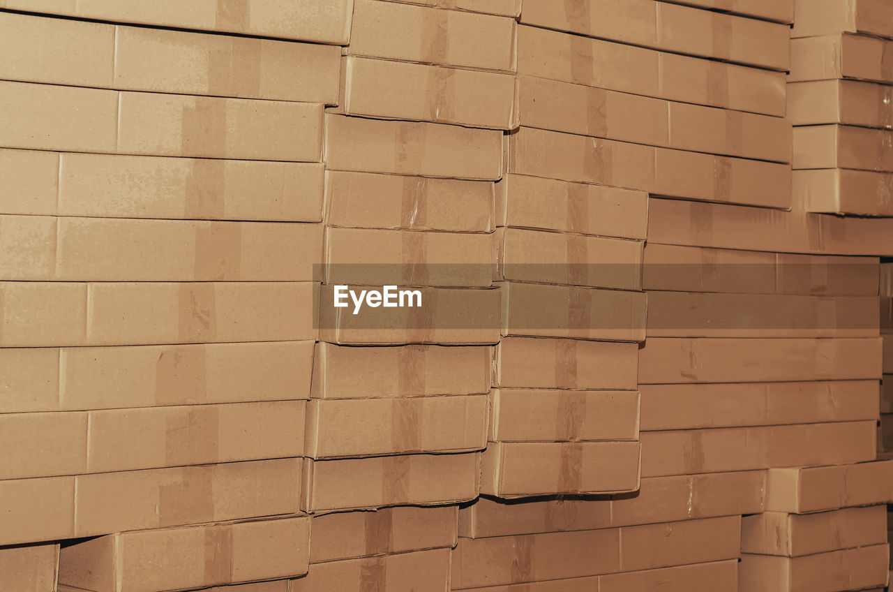 Stack of cardboard boxes stacked in large rows. abstract background.