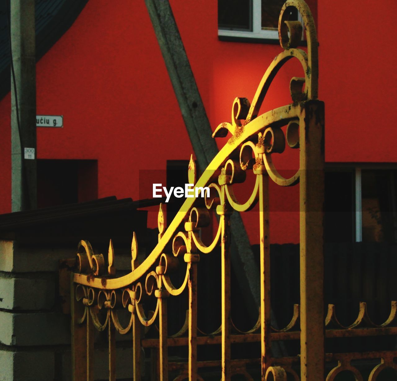 METAL GATE OF HOUSE DURING NIGHT