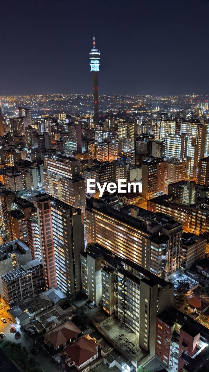 High angle view of city buildings at night