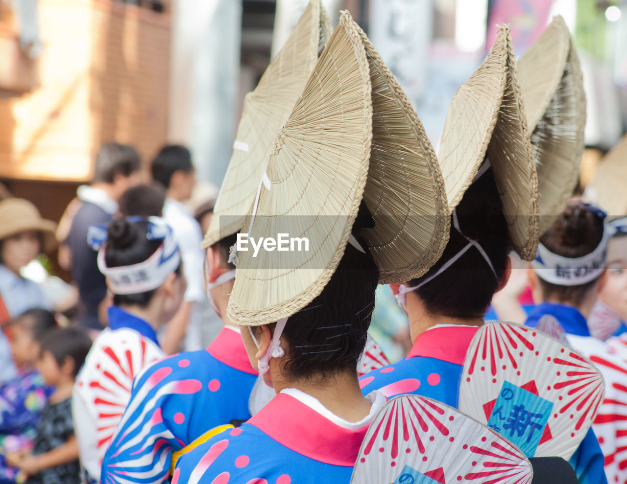 Rear view of women wearing traditional hat during awa odori