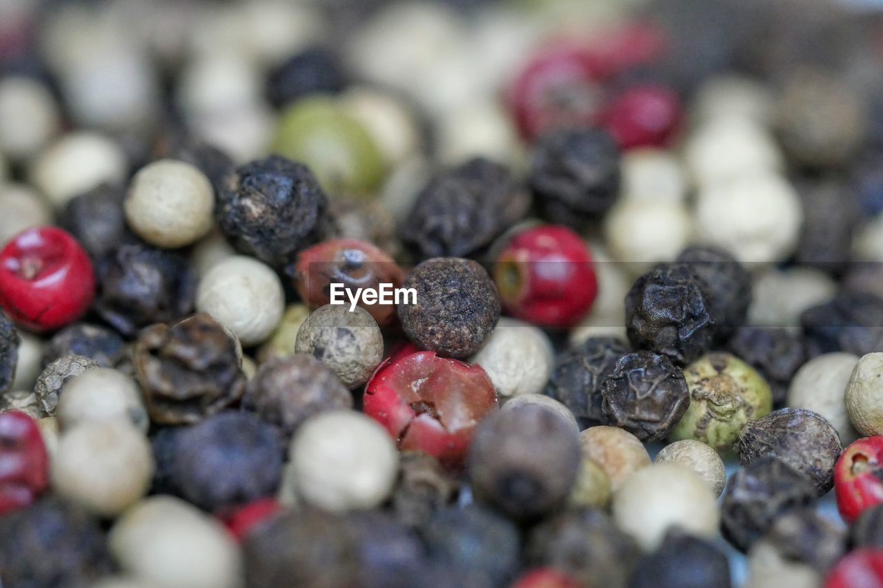 Full frame shot of peppercorns on table