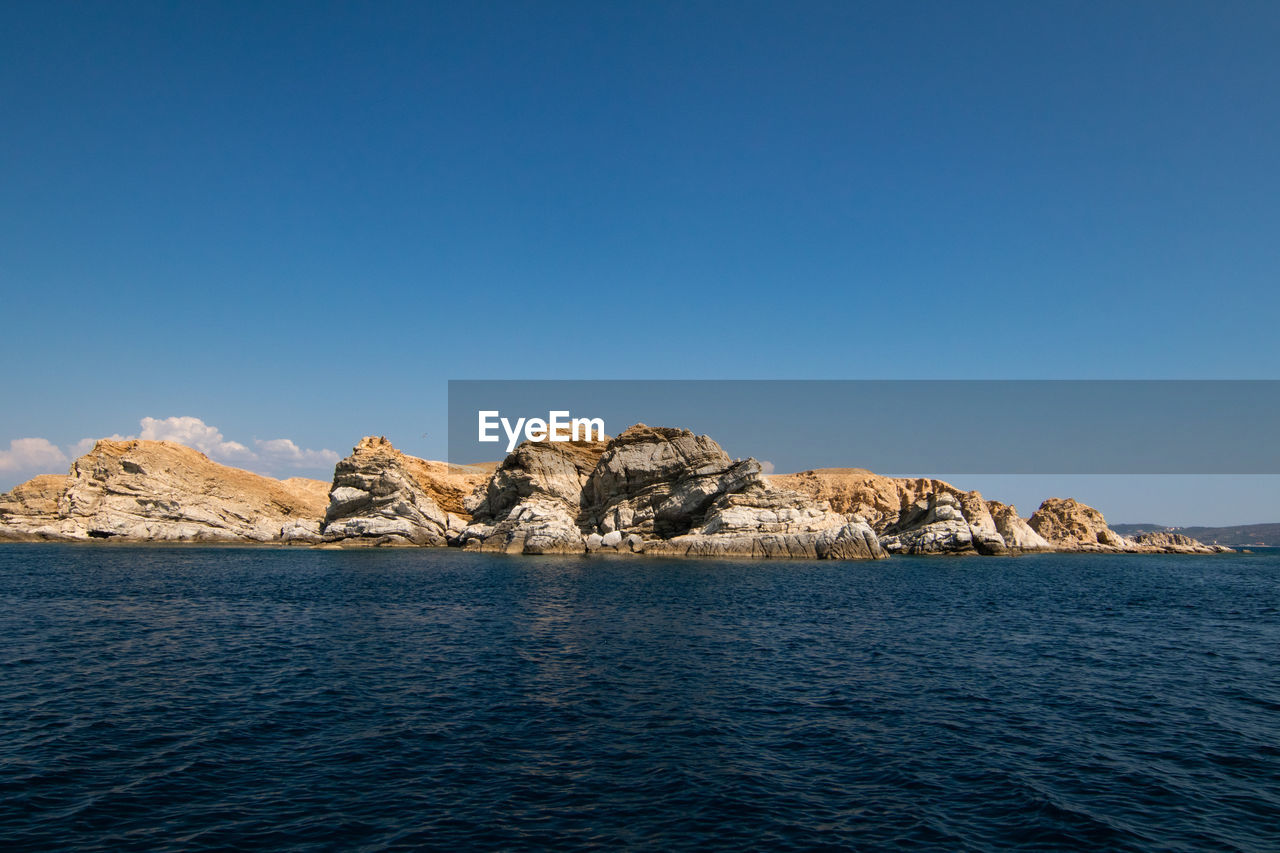 Scenic view of sea against clear blue sky