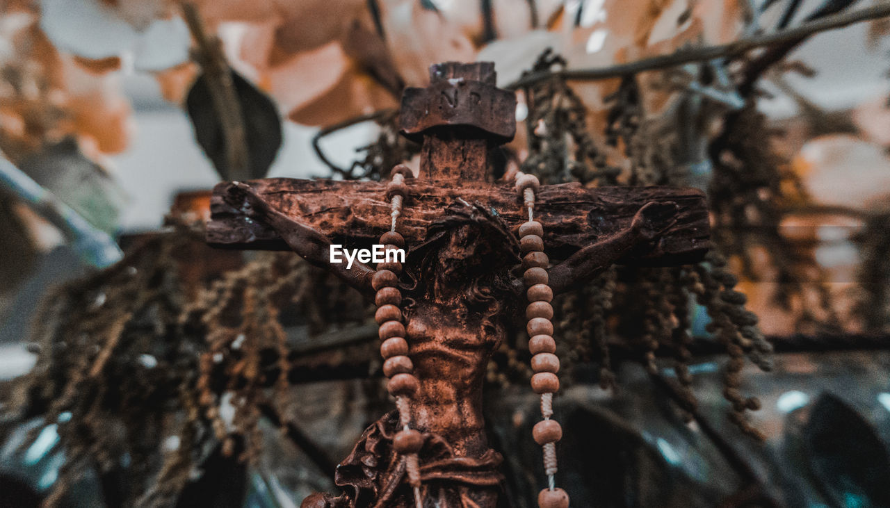 Close-up of rosary on crucifix