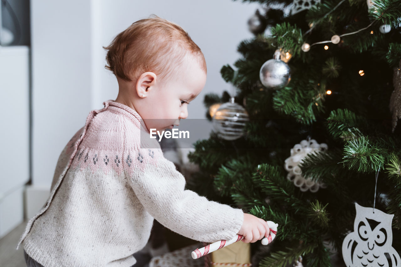 Cute baby girl at home during christmas